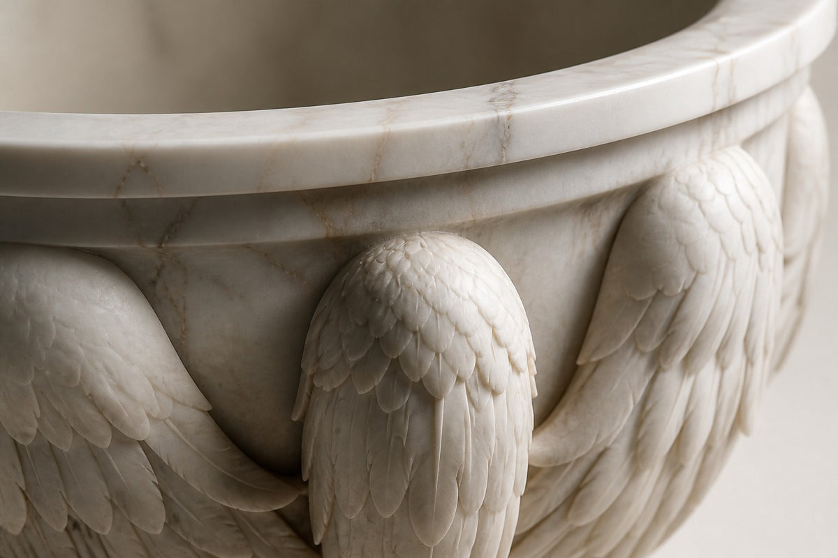 Carrara Winged Marble Urn Planter — 95 cm white Carrara marble urn planter carved with folded wings and an eagle head, close studio detail of the surface and material