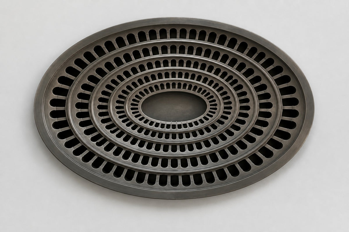 Cavea — 200 × 14 cm gunmetal oval wall relief of concentric rings of arched openings, studio view of the whole piece