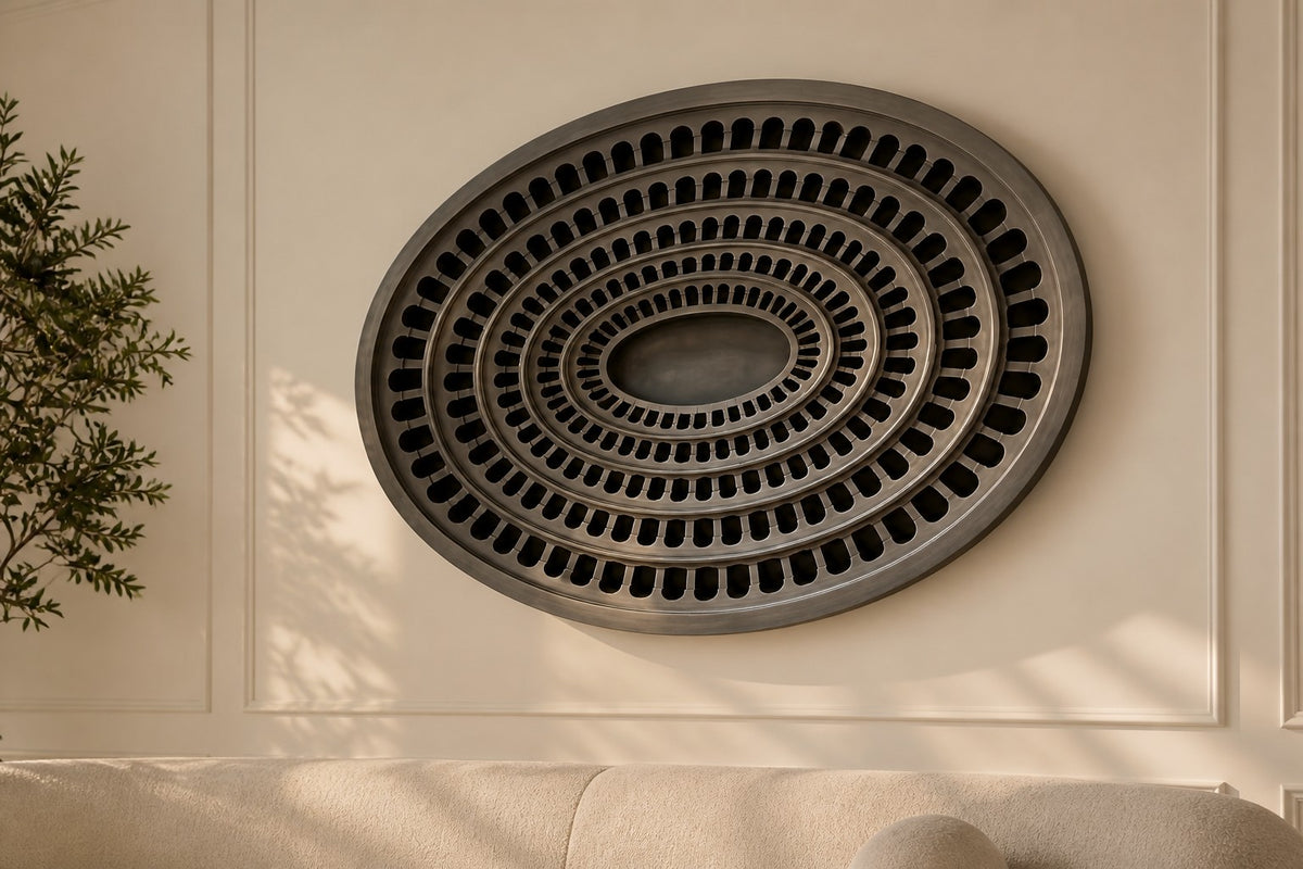 Cavea — 200 × 14 cm gunmetal oval wall relief of concentric rings of arched openings, close view in the room