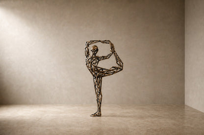 Bronze strut-cage figure sculpture Centina in a backbend on one leg, gilt and blackened, on a fluted travertine drum plinth.