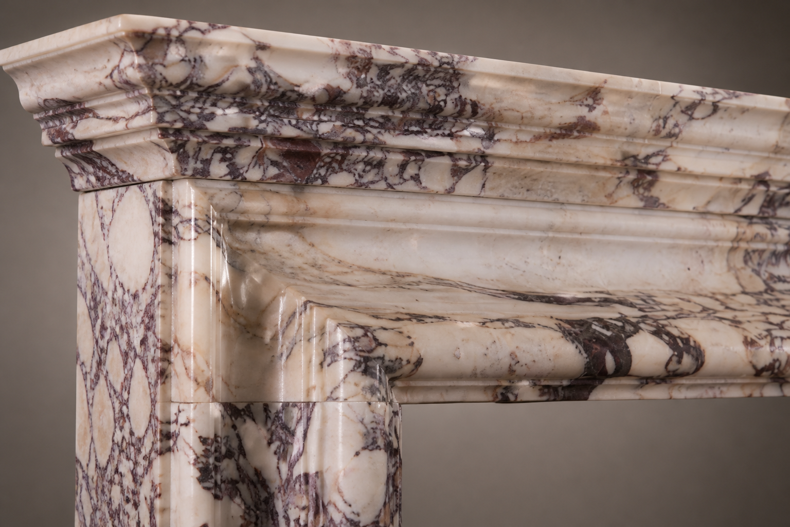 Sumire breccia viola marble fireplace mantel by 1-OPH, surface detail