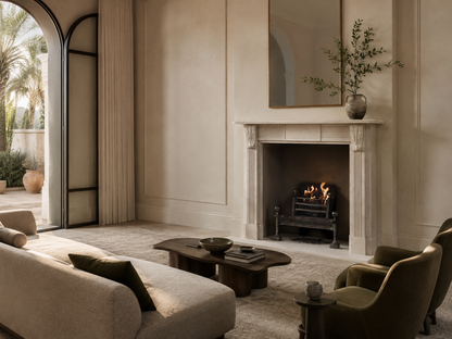 Abrigo cream limestone fireplace mantel by 1-OPH, in a Dubai interior