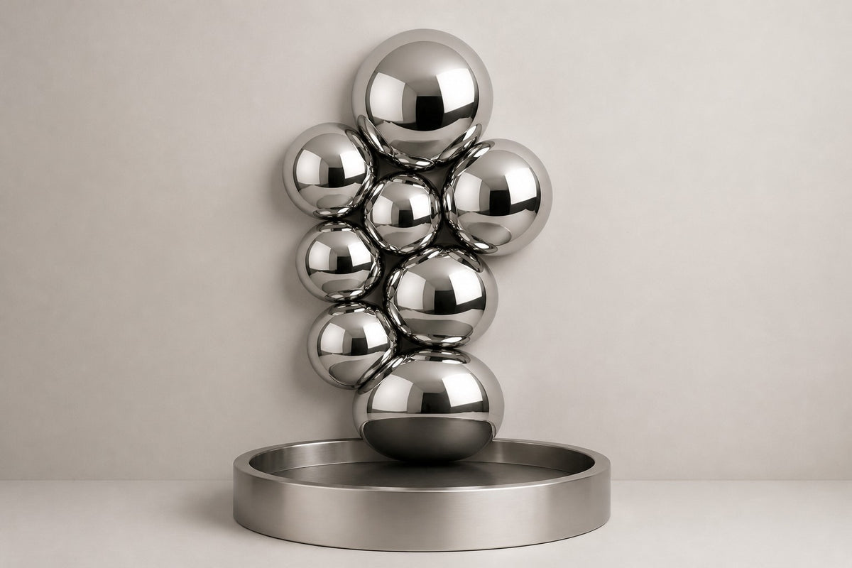 Cirrus — mirror-dome wall fountain, studio front view