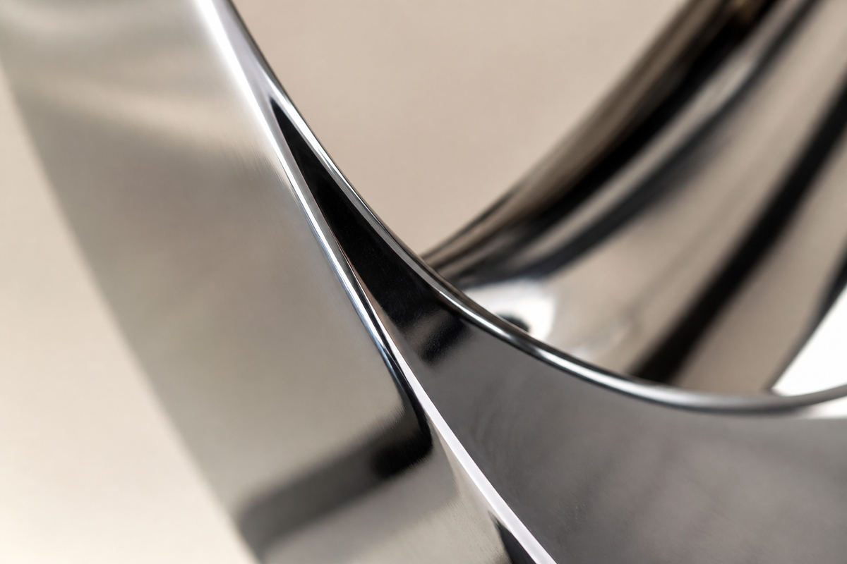 CONTINUUM stainless steel sculpture, close studio detail of the surface and material