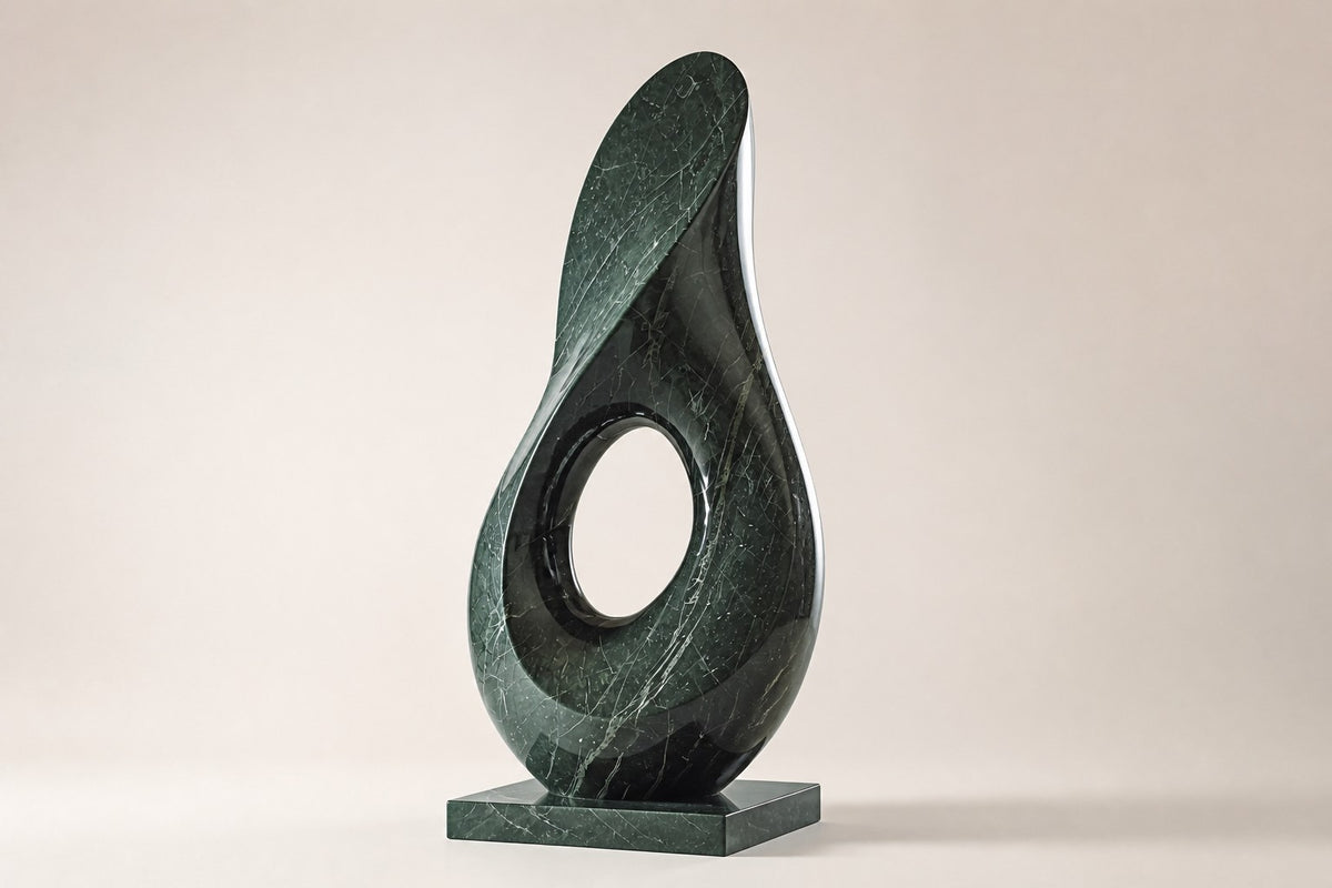 VOID II — 180 cm green marble teardrop sculpture with a twist and an oval hole, three-quarter studio view showing its profile