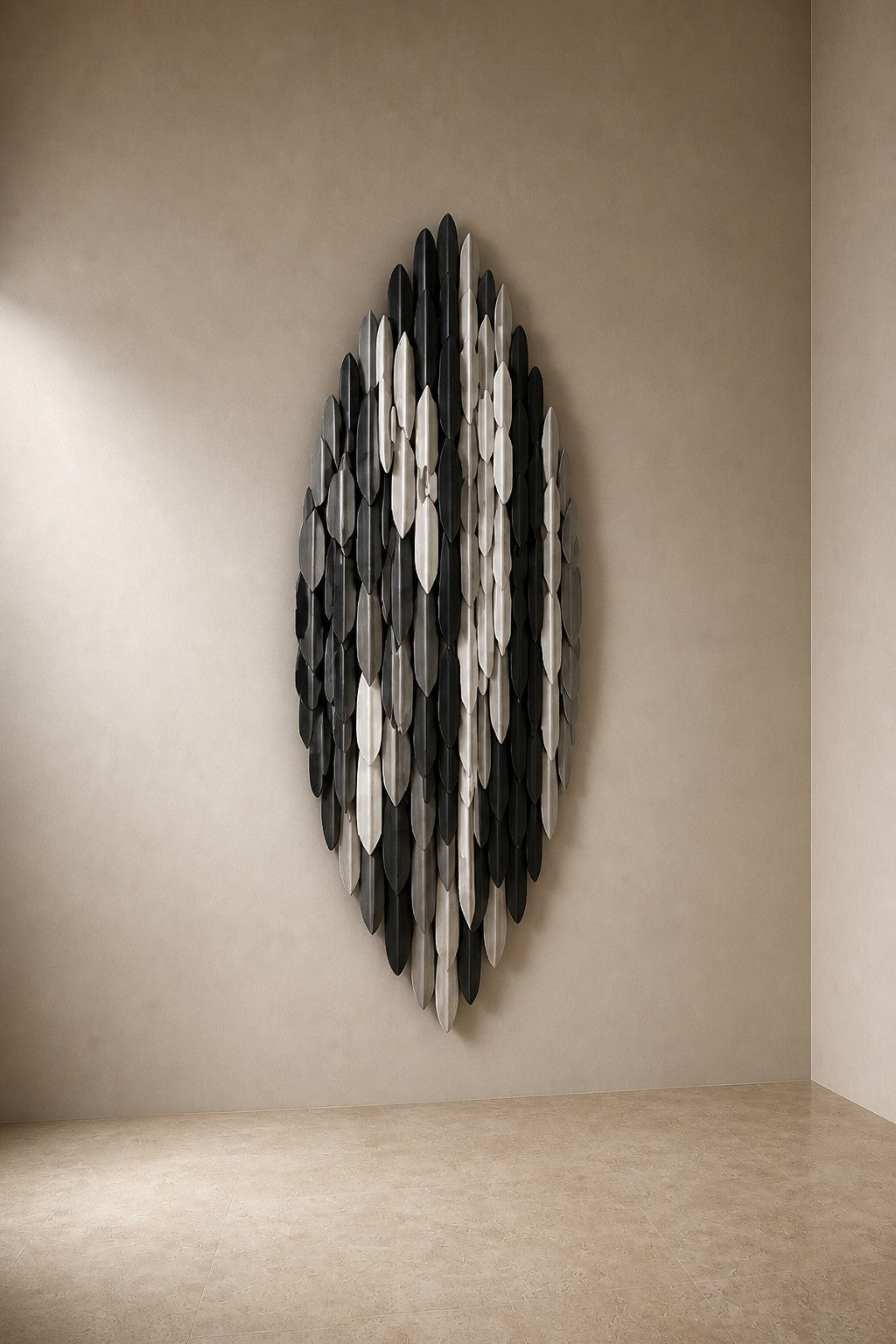 Cumulo — 85 × 150 cm tall oval wall sculpture of black, gold and white plates, three-quarter studio view showing its profile