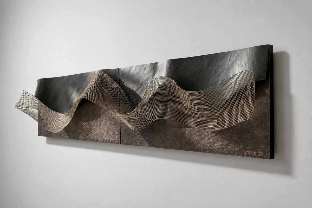 Dobra — folded dark bronze wall sculpture with a brass mesh wave, studio side angle showing its depth