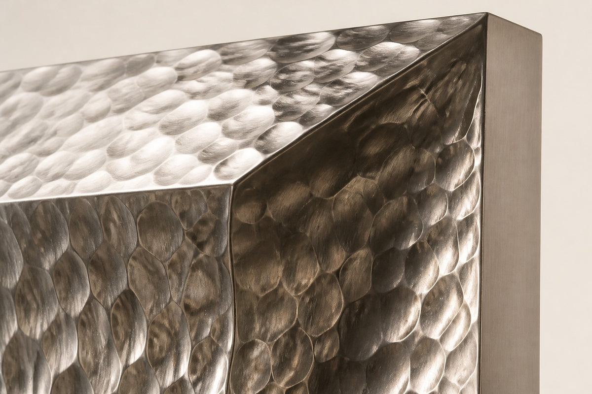 Drift — hammered stainless panel wall fountain, close detail of the surface and edge