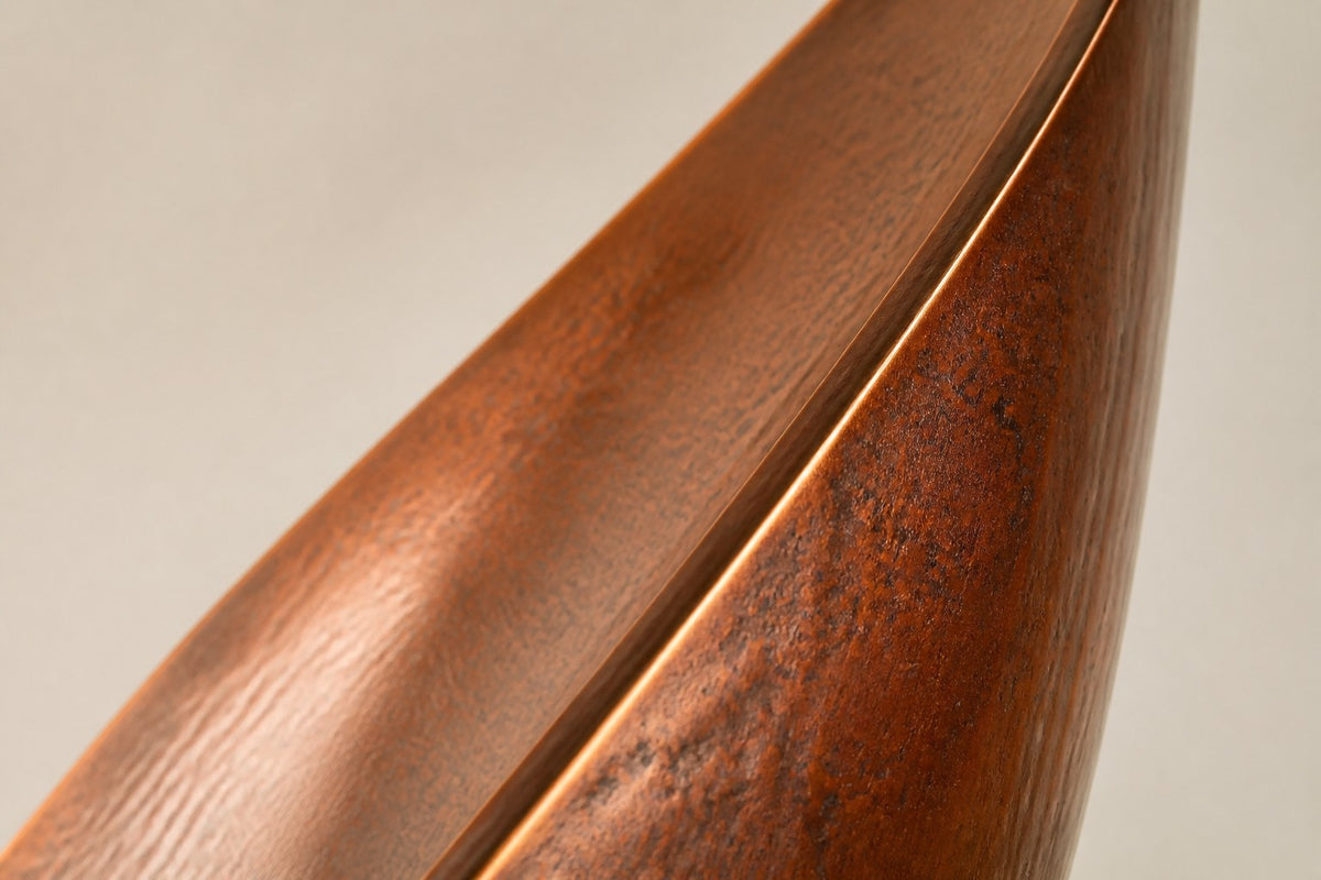 EMBER / RISE I — 200 cm leaf-shaped Corten steel water feature in a round stone basin, close studio detail of the surface and material