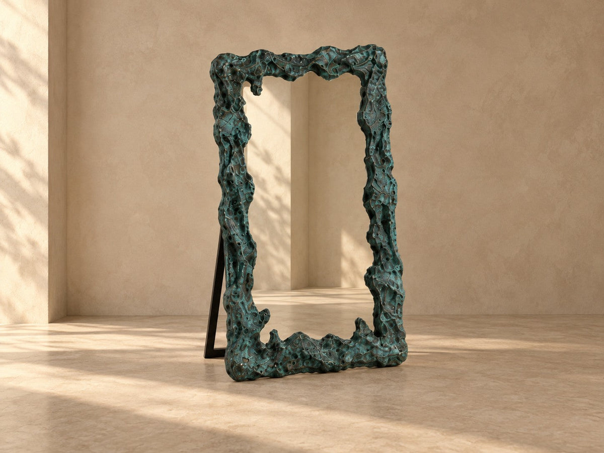 Estanque — 110 × 200 cm tall standing mirror with a rough cast frame in blue-green patinated bronze, studio view of the whole piece
