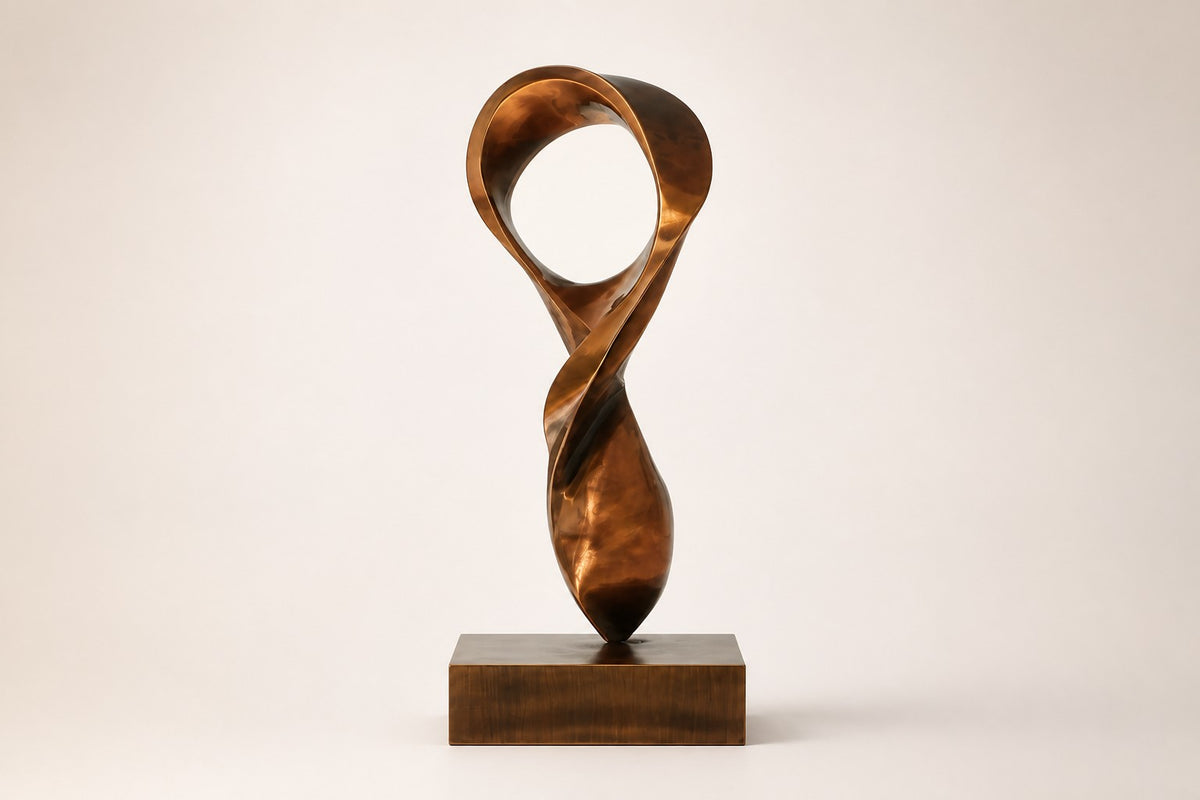 ETERNAL FLUX — 250 cm polished bronze sculpture of a twisting ribbon rising into an open loop, studio view of the whole piece