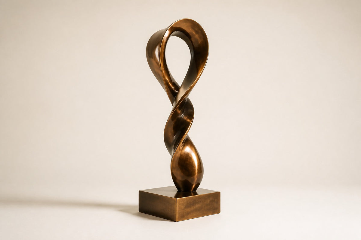 ETERNAL FLUX — 250 cm polished bronze sculpture of a twisting ribbon rising into an open loop, three-quarter studio view showing its profile