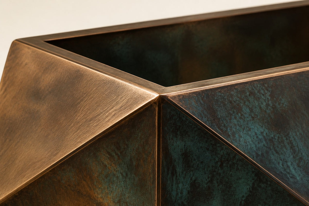 Facet Planter — 45 cm faceted trough planter with triangular copper and verdigris-patina panels, close studio detail of the surface and material
