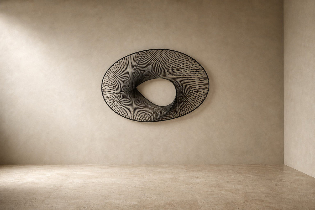 Falak — 180 × 110 cm brushed steel wire wall sculpture woven into a twisted ring, studio view of the whole piece