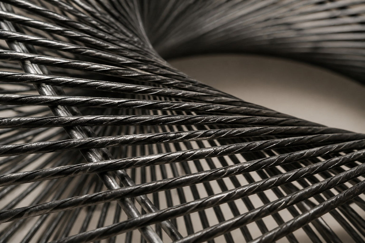 Falak — 180 × 110 cm brushed steel wire wall sculpture woven into a twisted ring, close studio detail of the surface and material