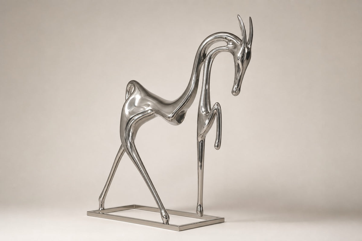 Faras — 235 cm tall mirror-polished steel horse sculpture in slender stylised form, three-quarter studio view showing its profile