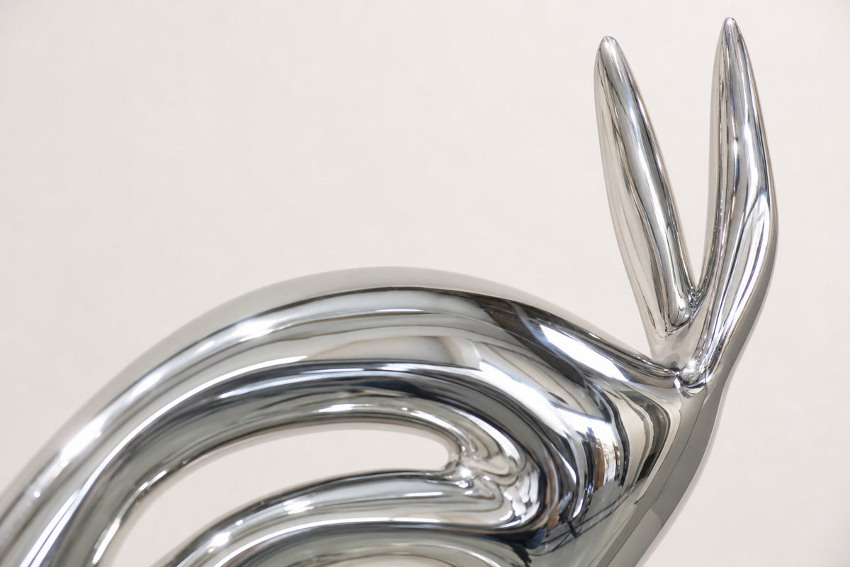 Faras — 235 cm tall mirror-polished steel horse sculpture in slender stylised form, close studio detail of the surface and material