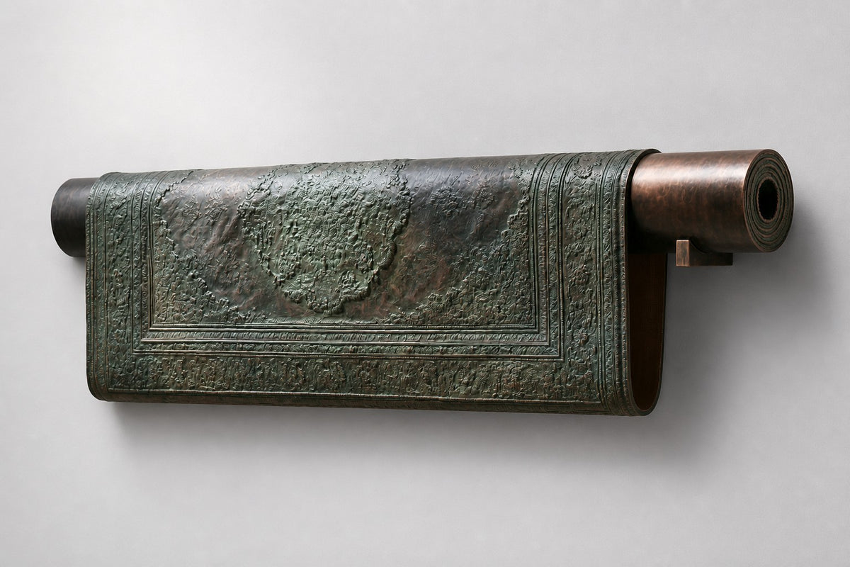 Farsh — patinated bronze wall sculpture of a partly rolled Persian carpet, studio front view
