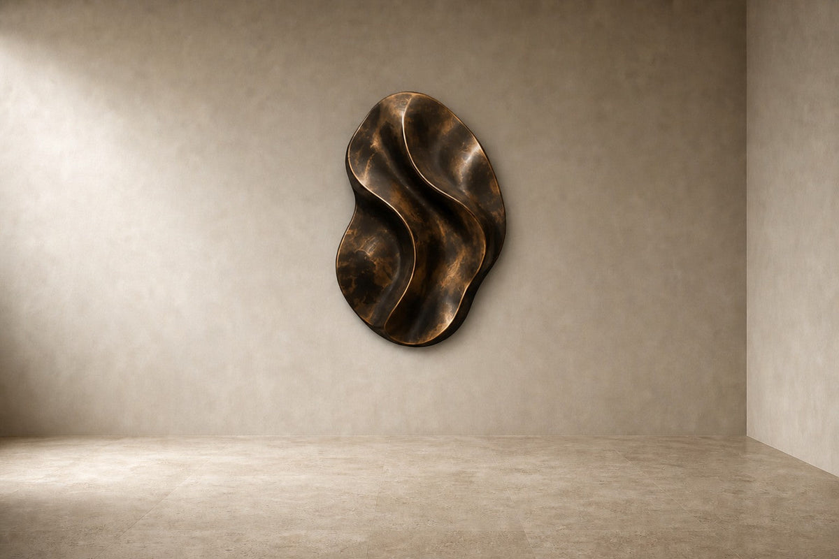 Fascia — 90 × 130 cm bronze wall relief of a folded oval ribbon, studio view of the whole piece