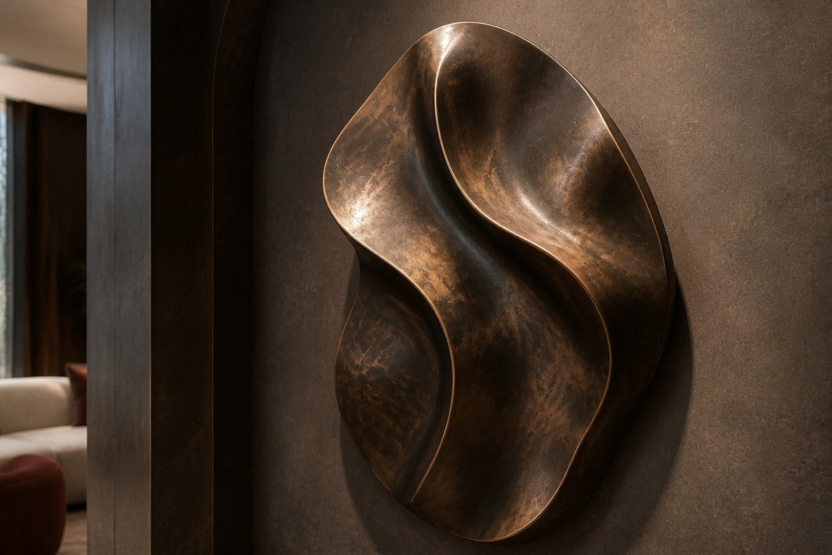 Fascia — 90 × 130 cm bronze wall relief of a folded oval ribbon, close view in the room