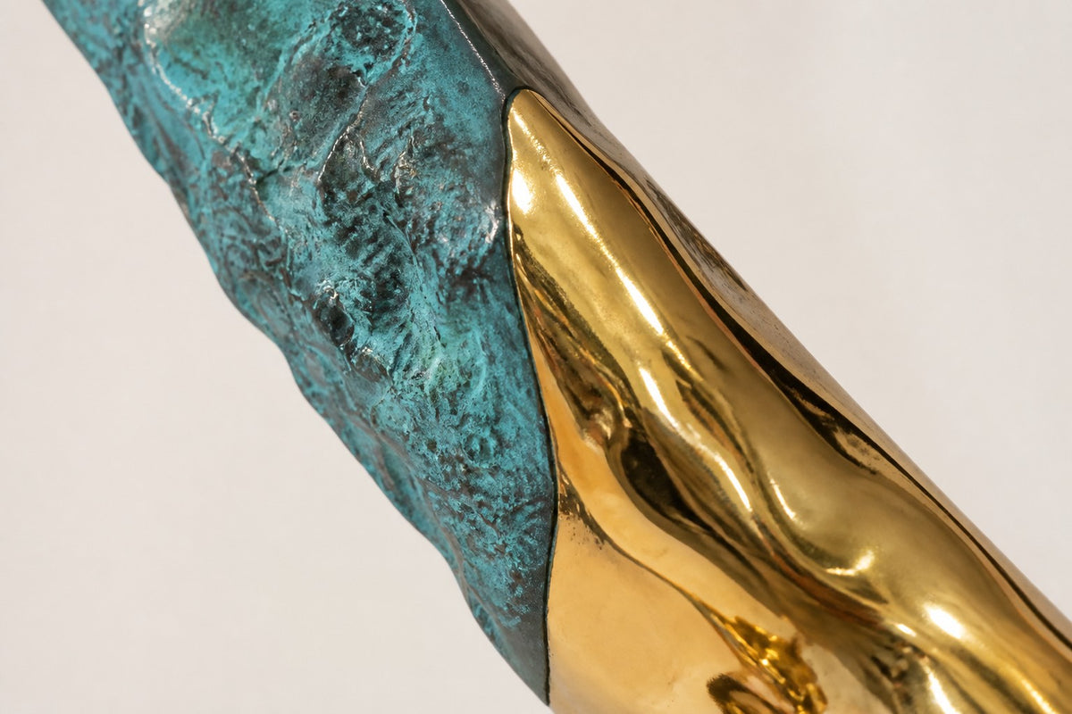 Fayruz — polished gold and turquoise curved sculpture on a black base, close detail of the surface and edge