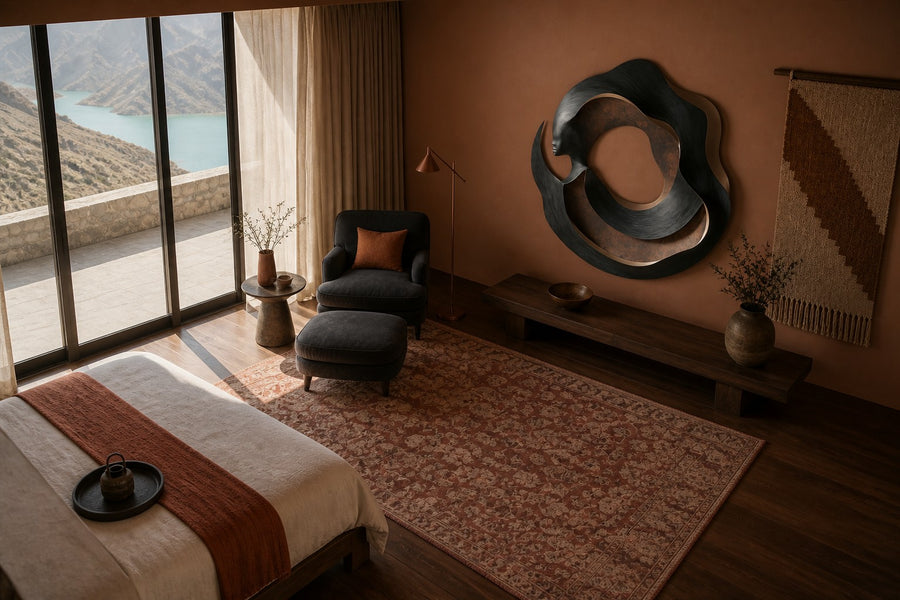 Figura — bronze and copper circular wall sculpture with a woman's profile, seen from above in the room