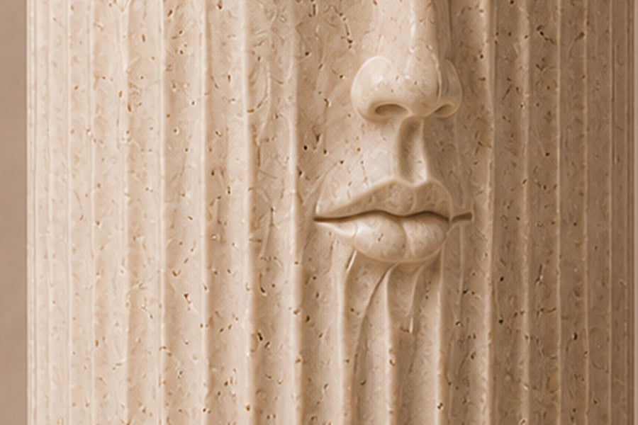Fluted cream travertine drum on a round moulded foot, with a face carved through the flutes — close detail of the surface