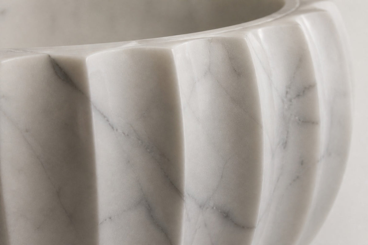 Fluted Marble Urn Planter — 70 cm white marble urn planter carved in broad flutes with a scalloped rim, close studio detail of the surface and material