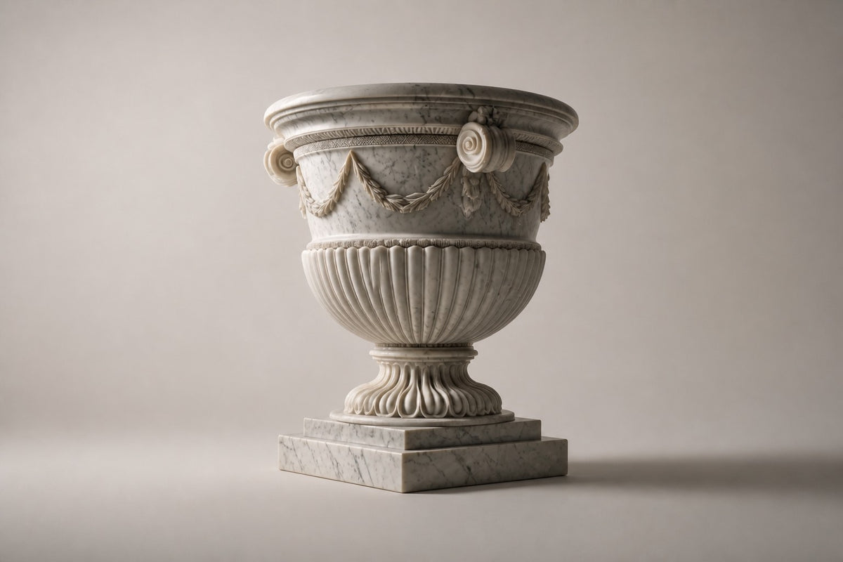 Garland Estate Marble Urn Planter — 105 cm white Carrara marble campana urn planter with a carved garland and scroll handles, three-quarter studio view showing its profile