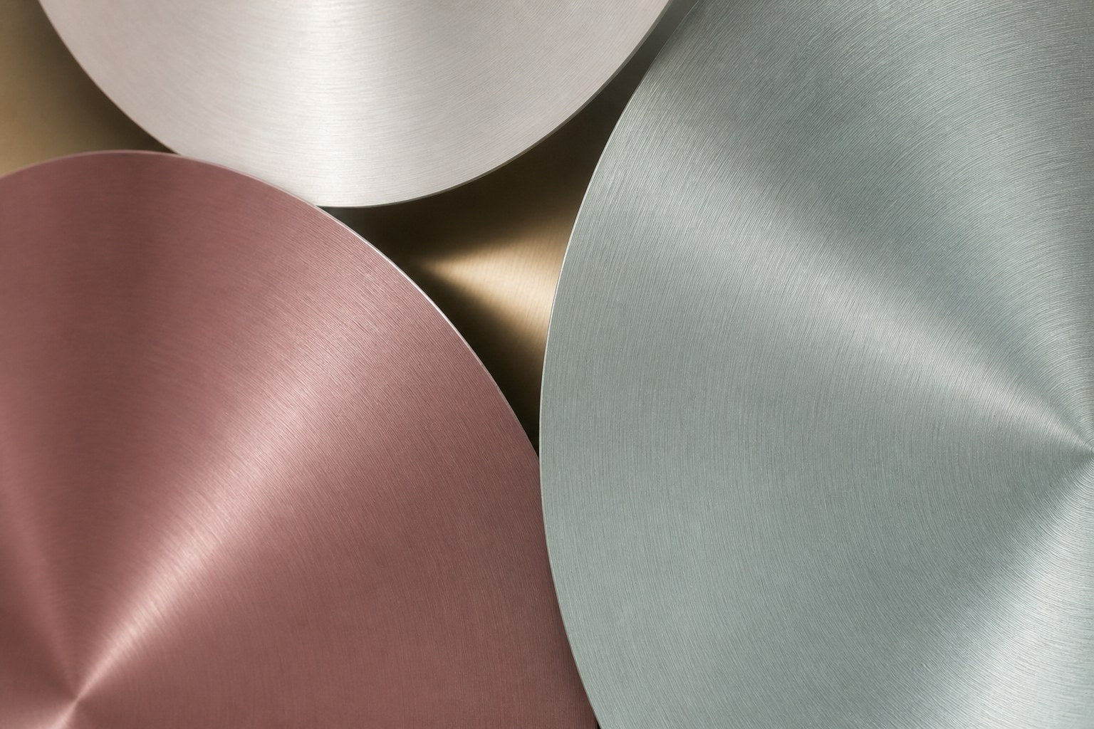 Cluster of overlapping spun discs in white, cream, sage and dusty pink with gilt accents.