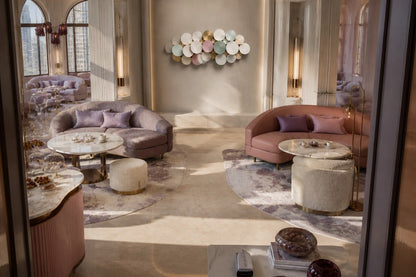 Cluster of overlapping spun discs in white, cream, sage and dusty pink with gilt accents.