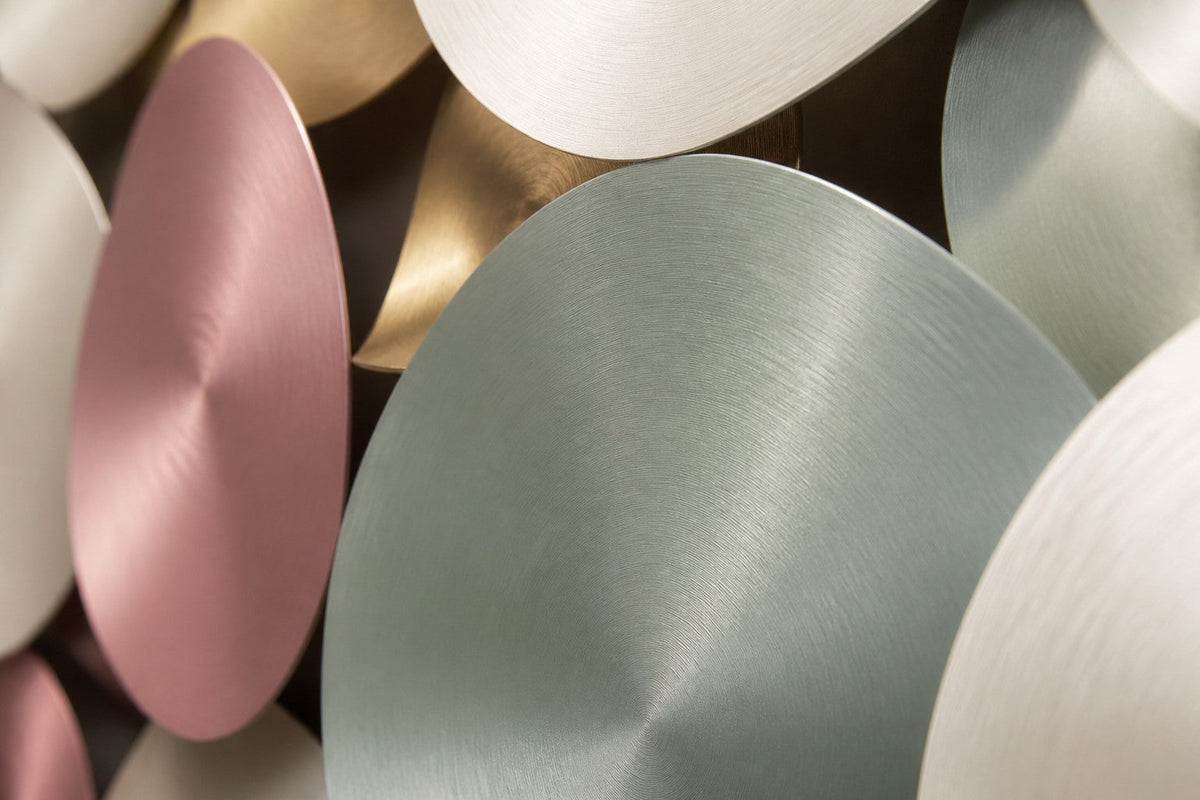 Ghimam — 200 × 80 cm wall cluster of spun discs in pastel pink, mint and gold, close studio detail of the surface and material