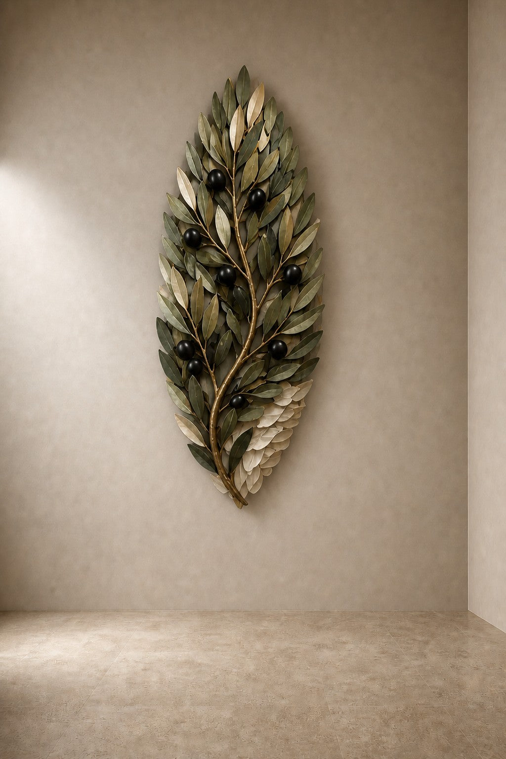 Olive green and dark bronze bronze wall sculpture Ramoscello, cast branch with individually mounted leaves and fruit, on a plaster wall.