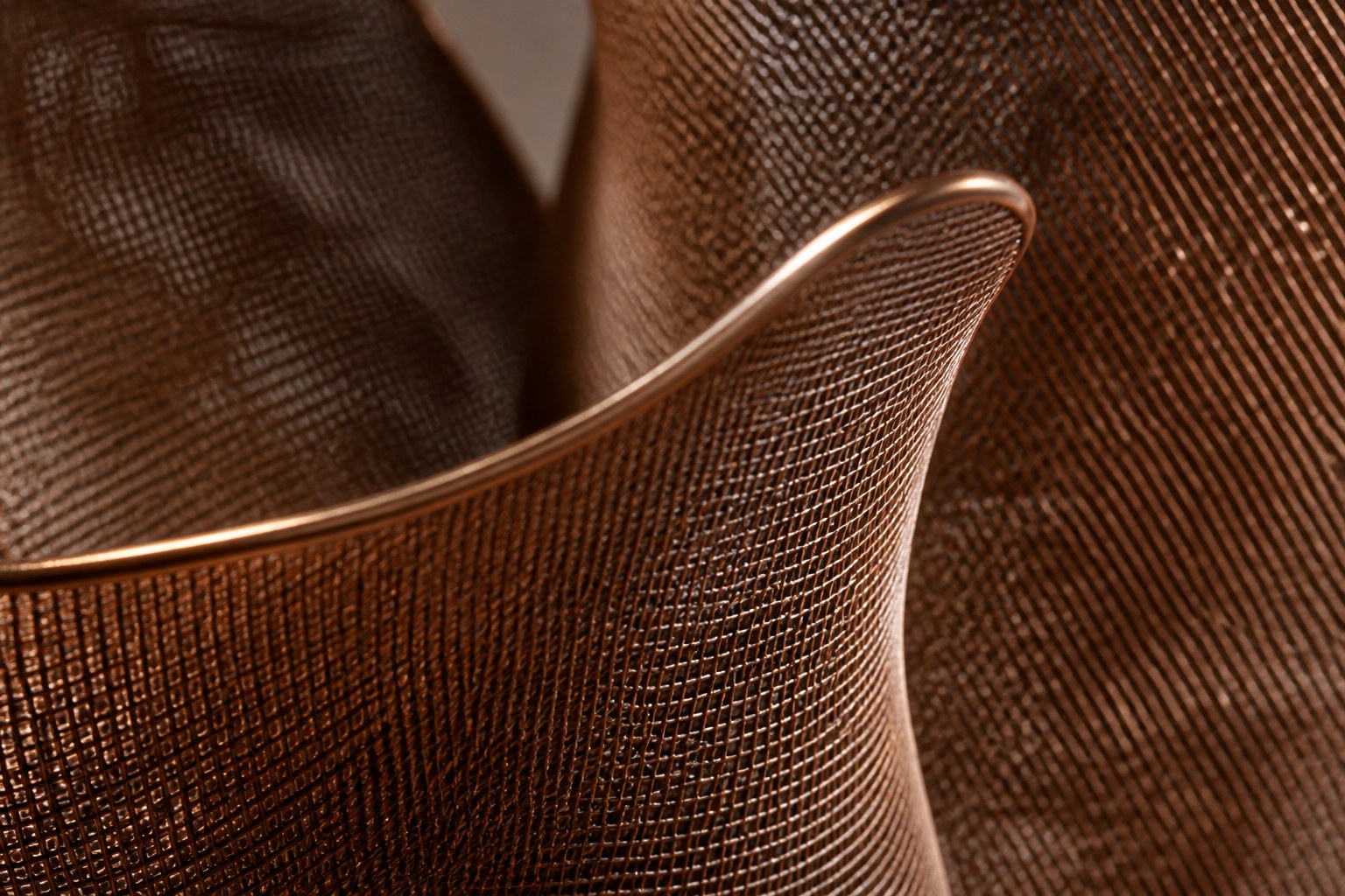 Woven bronze wire sculpture Gienah, a cluster of furled forms opening from a common gathered base.