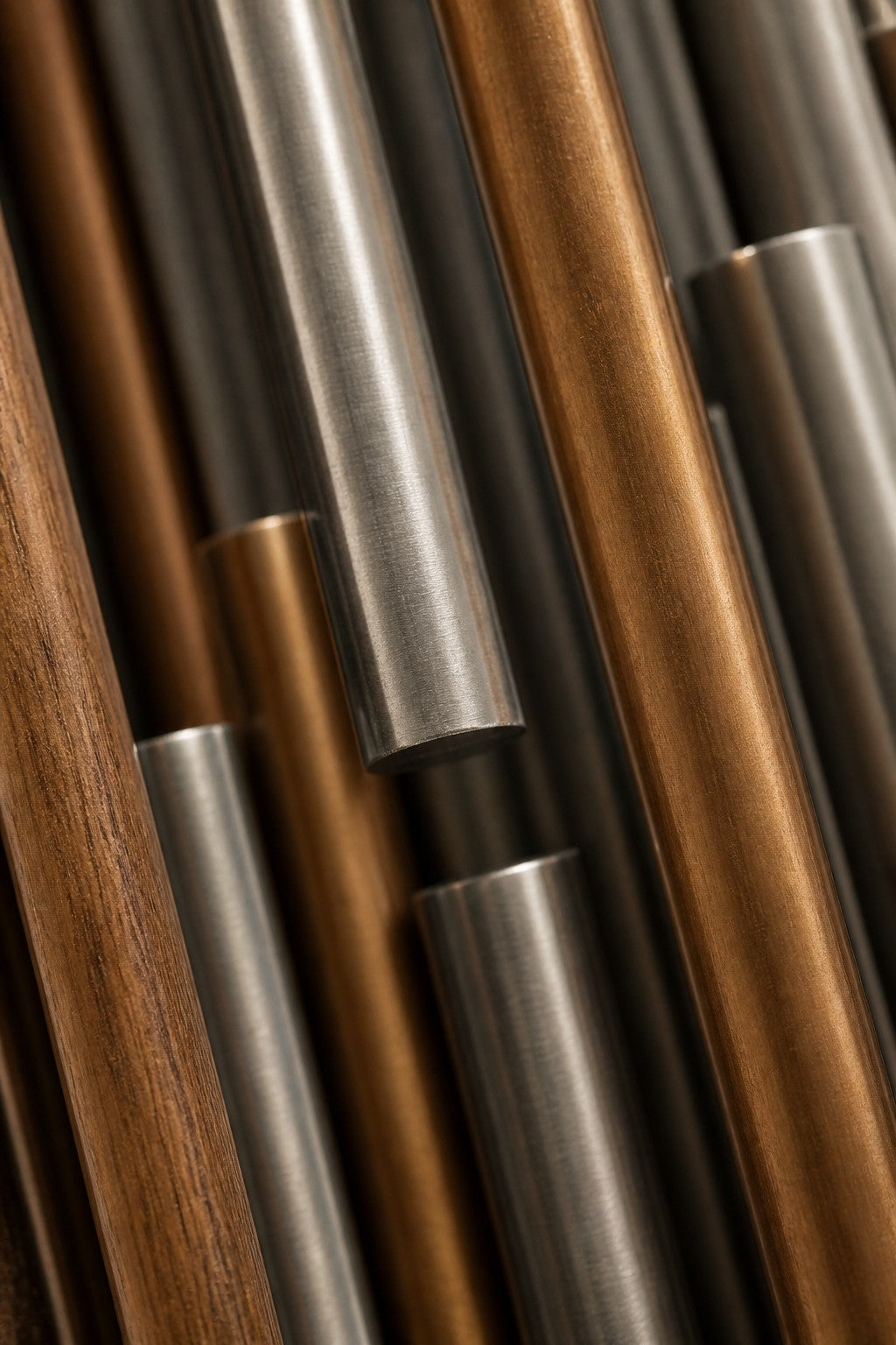 Giro — 80 × 160 cm vertical cluster of slender rods in steel, brass and timber, close studio detail of the surface and material
