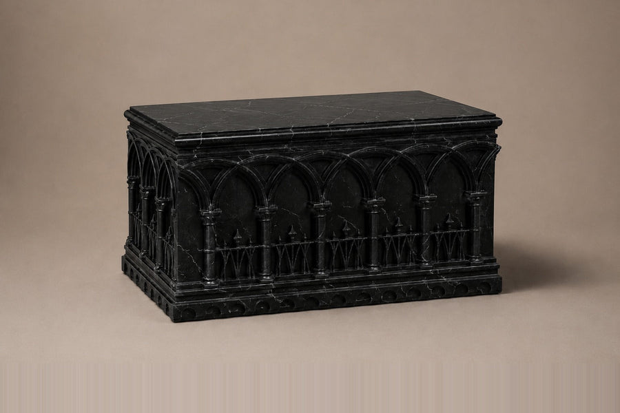 Low wide black Nero Marquina marble base carved with an arcade of pointed Gothic arches on colonnettes — three-quarter studio view of the whole pedestal