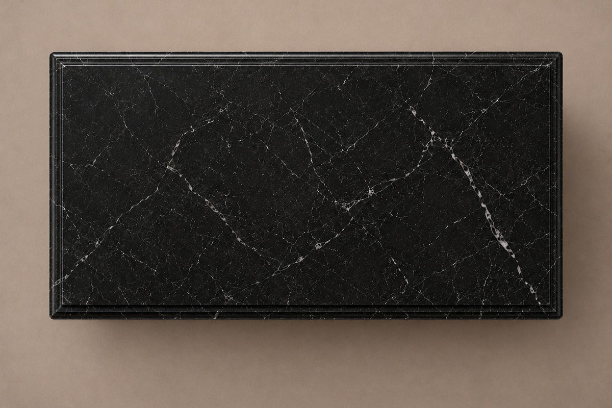 Low wide black Nero Marquina marble base carved with an arcade of pointed Gothic arches on colonnettes — viewed from directly above