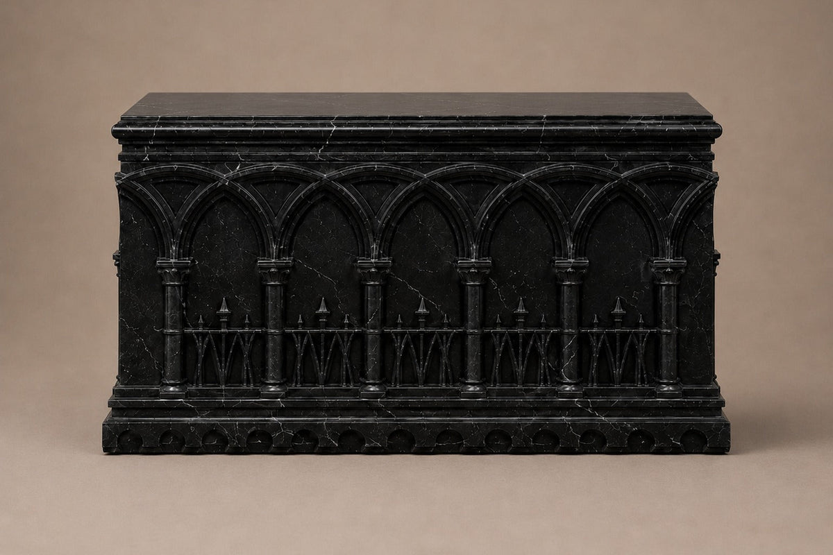 Low wide black Nero Marquina marble base carved with an arcade of pointed Gothic arches on colonnettes — front elevation
