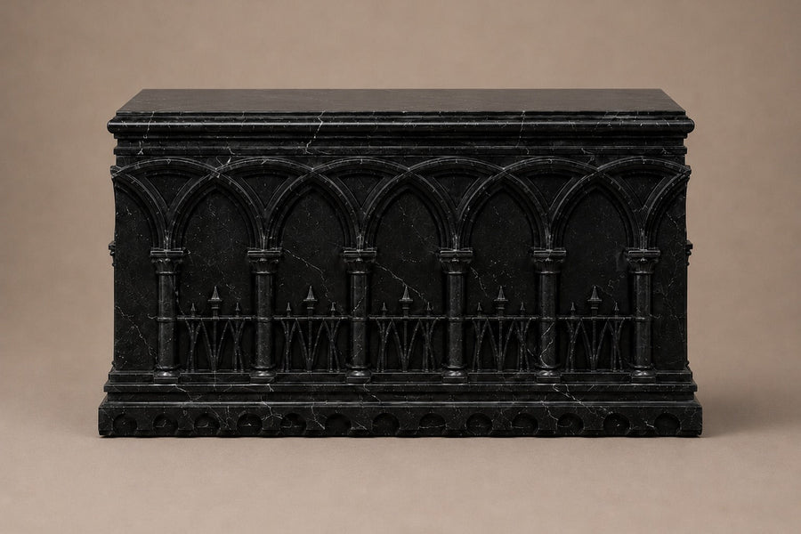 Low wide black Nero Marquina marble base carved with an arcade of pointed Gothic arches on colonnettes — front elevation