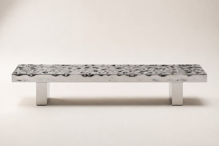 Hamon — rippled mirror stainless steel bench, studio front view