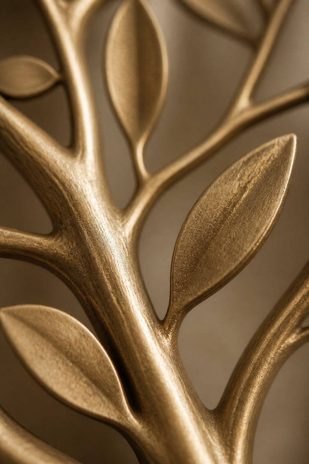 Hamsa 130 — 130 cm brushed brass wall sculpture of a tree, close studio detail of the surface and material