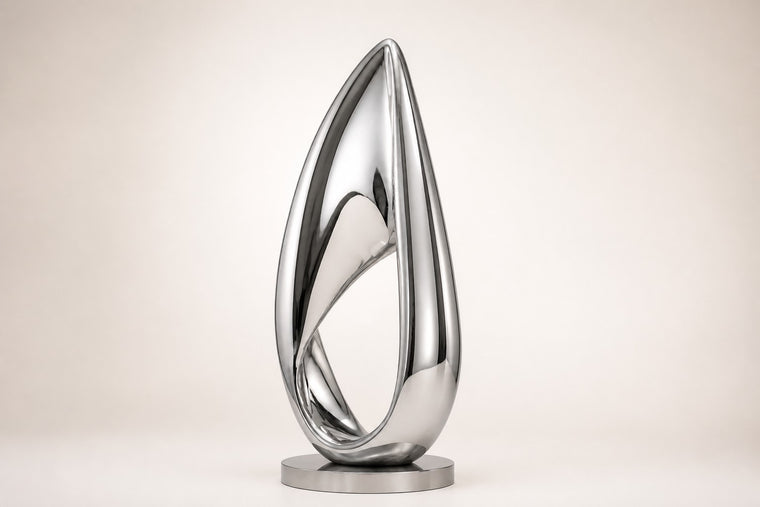 Hikari — mirror-polished stainless steel teardrop loop sculpture, studio front view