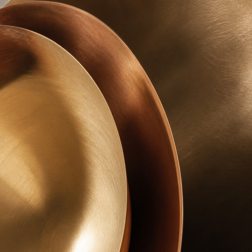 Hilal — 100 × 100 cm wall sculpture of overlapping dark and polished bronze bowls, close studio detail of the surface and material