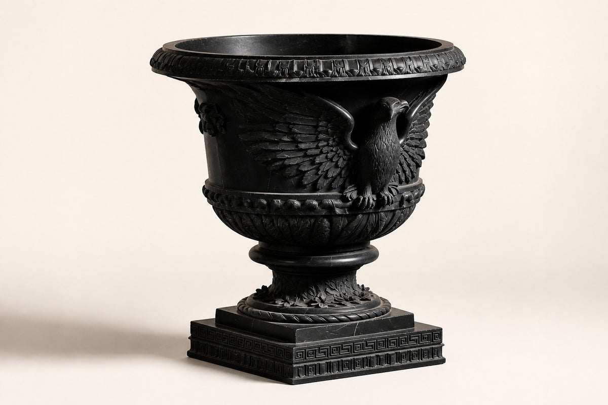 Imperial Eagle Black Marble Urn Planter — 100 cm black marble urn planter with a carved eagle and Greek-key bands, three-quarter studio view showing its profile