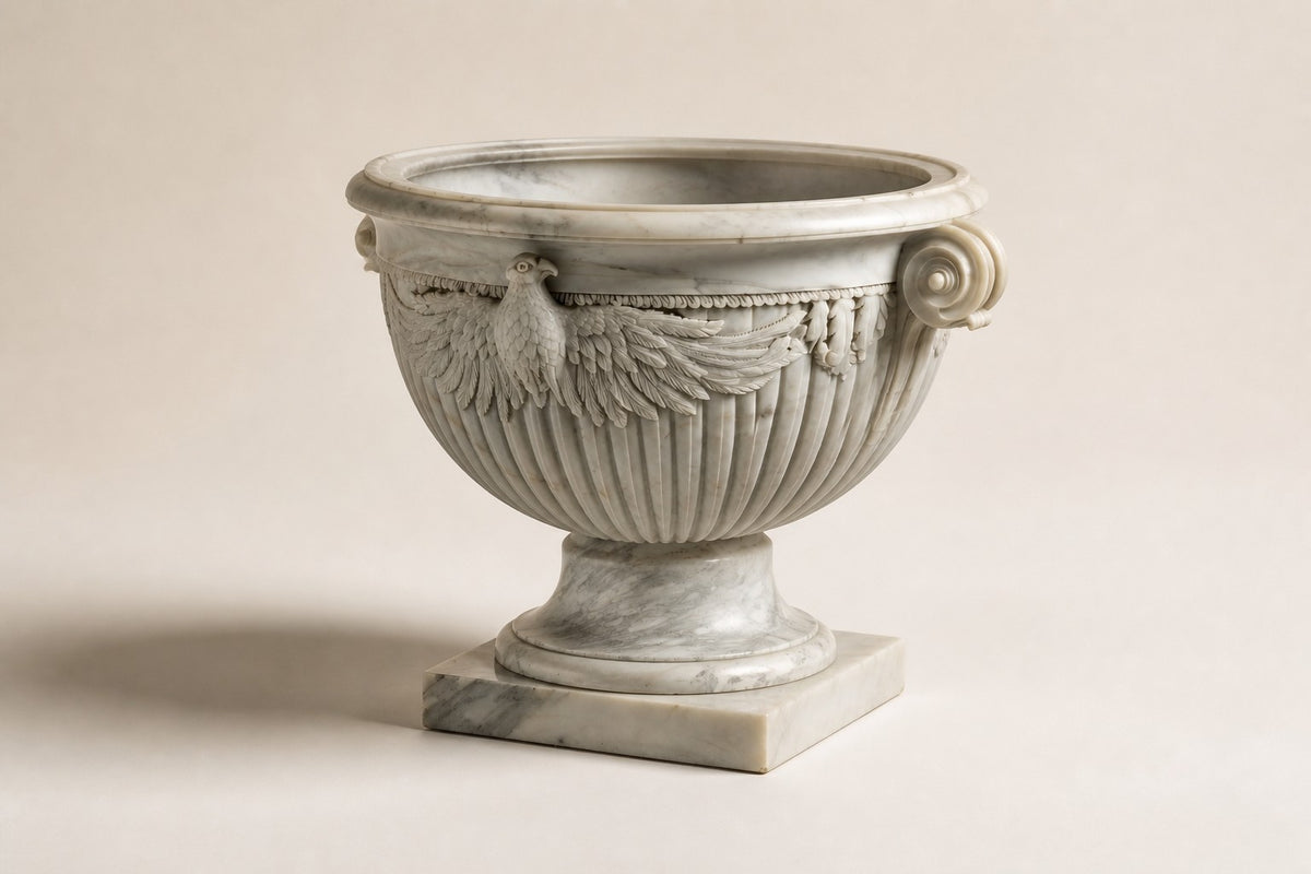 Imperial Eagle Marble Urn Planter — 90 cm white Carrara marble urn planter with a carved eagle and two scroll handles, three-quarter studio view showing its profile