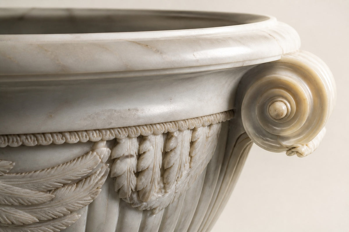 Imperial Eagle Marble Urn Planter — 90 cm white Carrara marble urn planter with a carved eagle and two scroll handles, close studio detail of the surface and material
