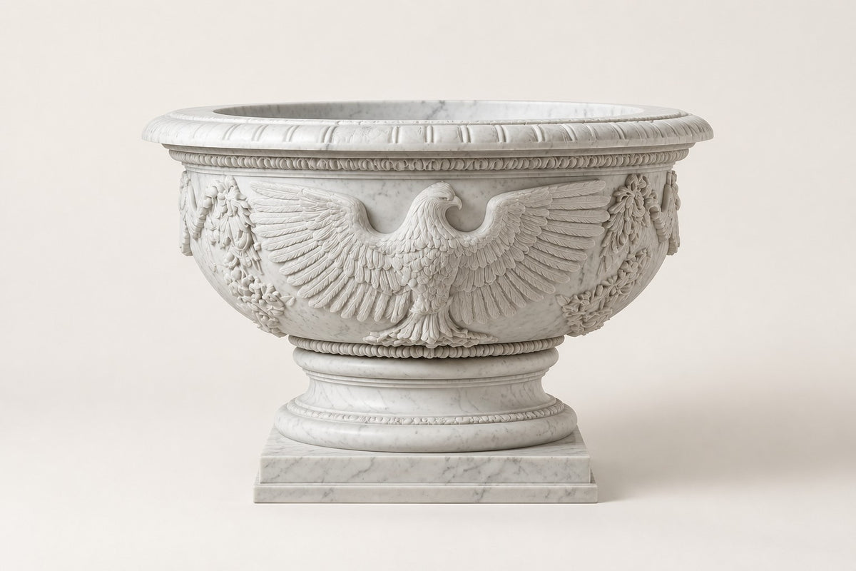 Imperial Eagle Marble Urn Planter — 110 cm white Carrara marble urn planter with a heavy carved rim and a carved eagle, studio view of the whole piece