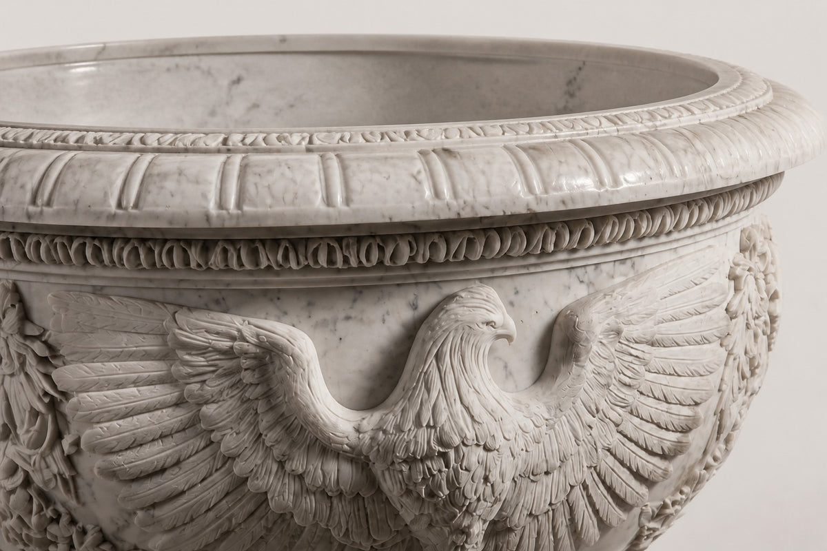 Imperial Eagle Marble Urn Planter — 110 cm white Carrara marble urn planter with a heavy carved rim and a carved eagle, close studio detail of the surface and material