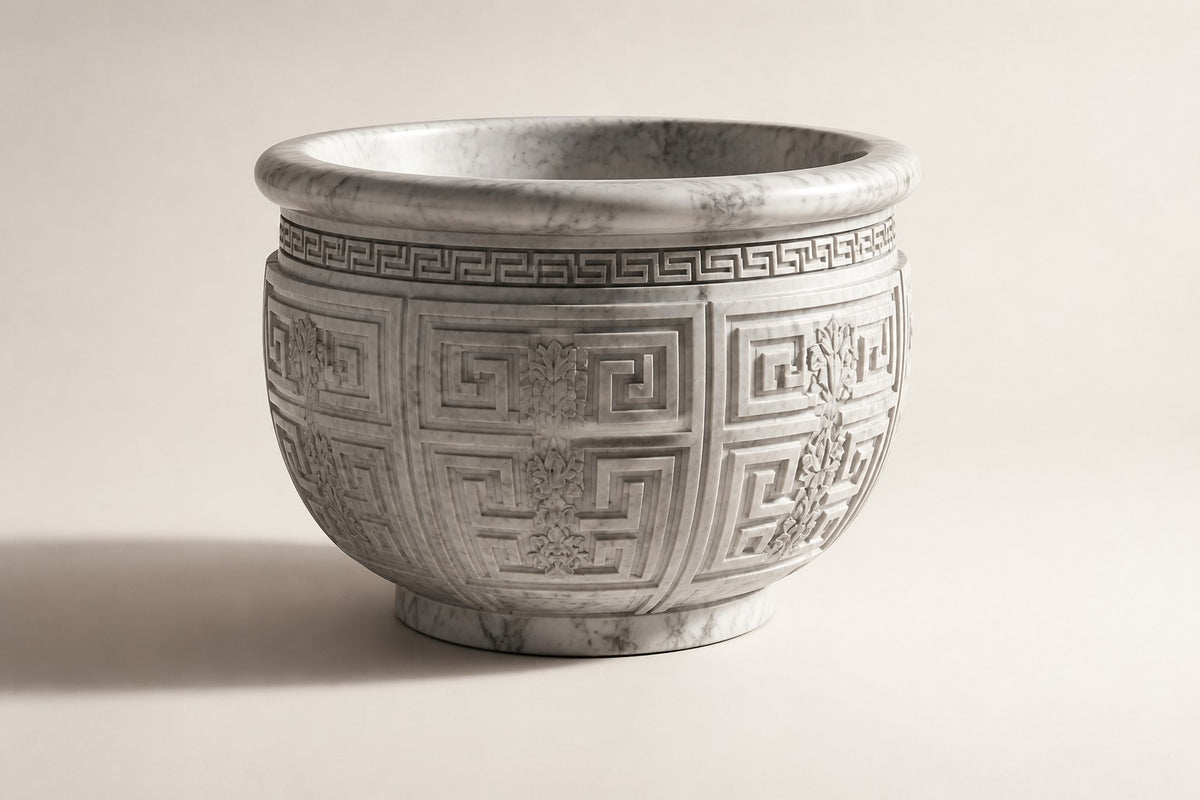 Imperial Helios Vessel — 190 cm monumental white Carrara marble planter carved with a Greek-key pattern, three-quarter studio view showing its profile