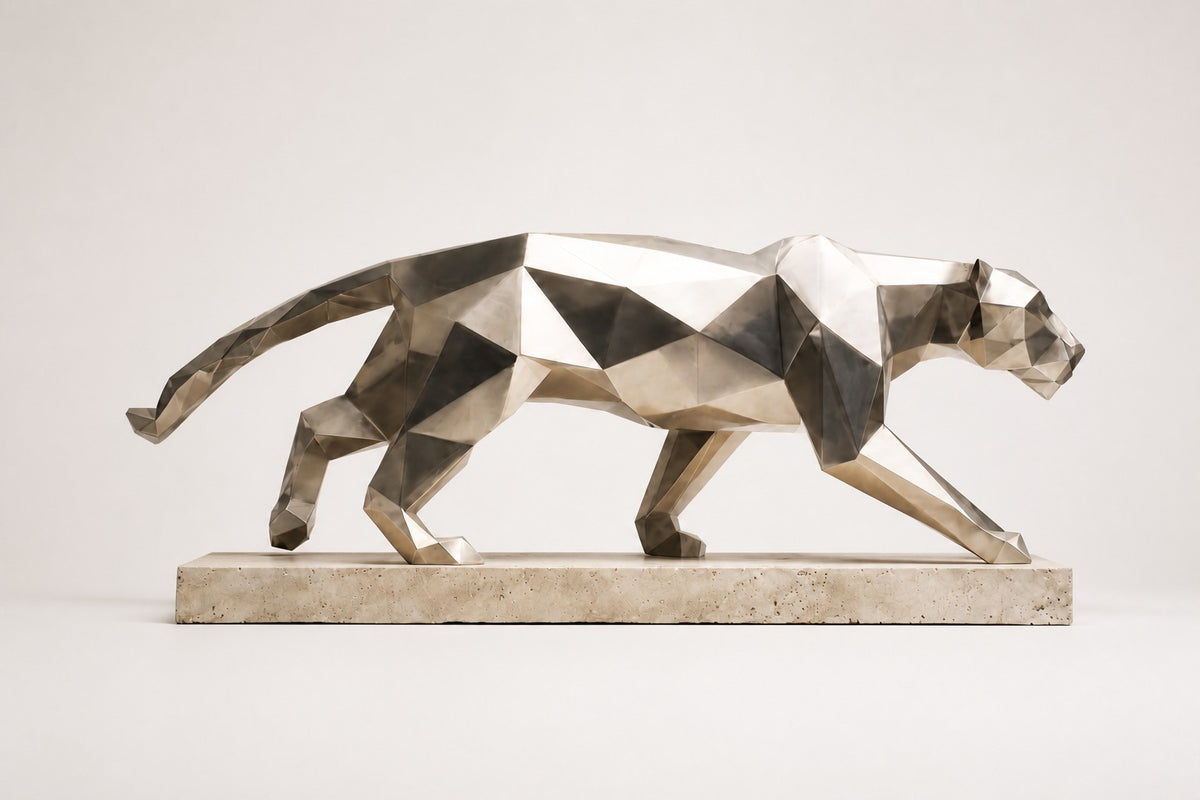 Imperial Stride Panther — 62 cm faceted stainless steel panther sculpture mid-stride on a travertine base, studio view of the whole piece